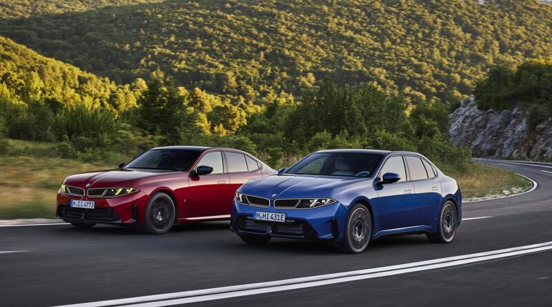 Nuova BMW Serie 3 rossa e BMW i3 blu su strada